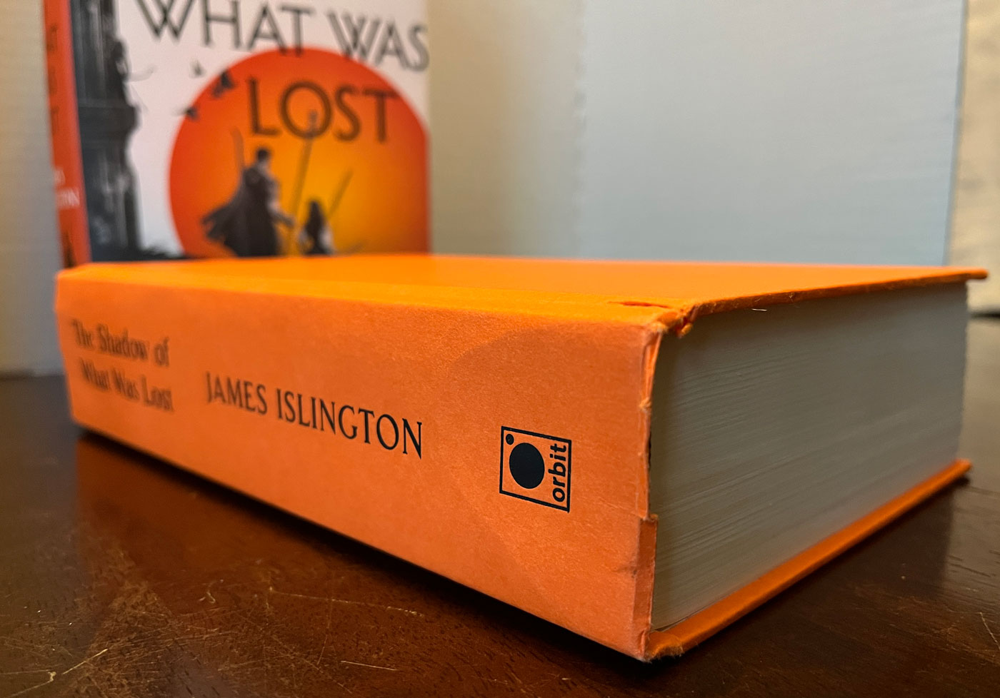 The Shadow of What Was Lost by James Islington damage at bottom of spine