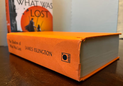 The Shadow of What Was Lost by James Islington damage at bottom of spine