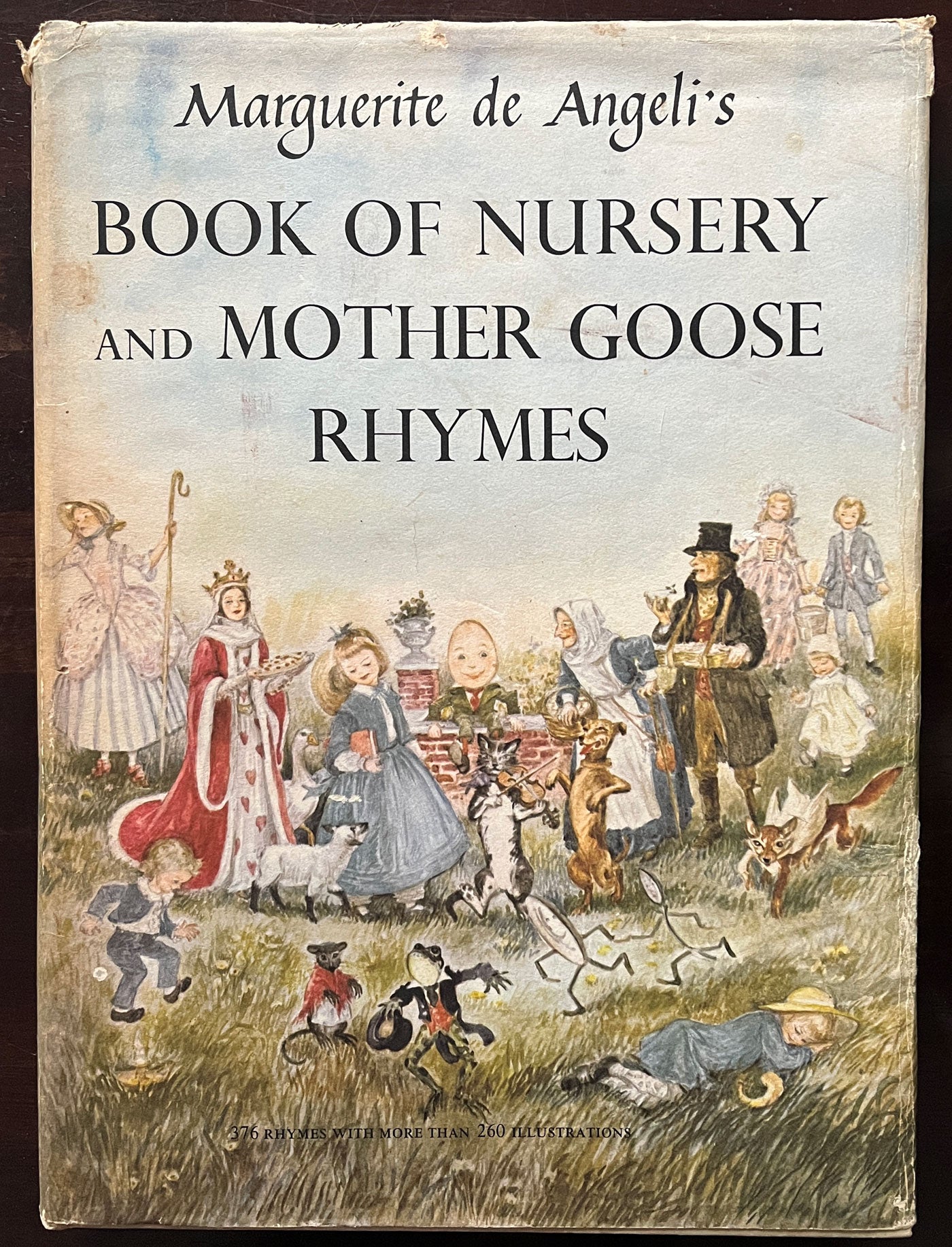 Front cover of Book of Nursery and Mother Goose Rhymes by Marguerite de Angeli, featuring illustrations of nursery rhyme characters.