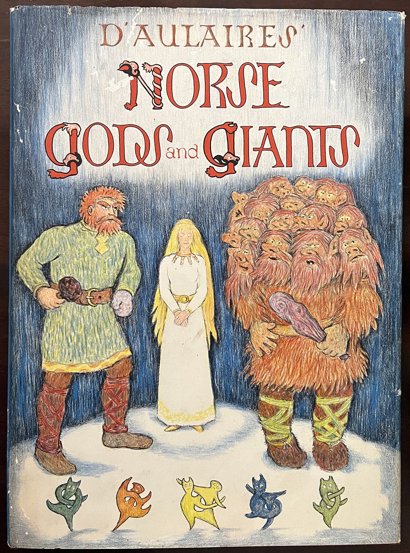 Front cover of D'aulaire's Norse Gods and Giants with an illustration of gods and giants.