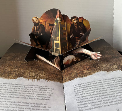 A page from a 3D pop-up book featuring a dark, gothic horror design. 