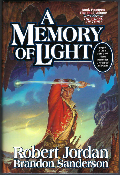 Front cover of A Memory of Light by Robert Jordan and Brandon Sanderson, showing a fantasy scene with a robed figure holding a glowing sword against a dramatic blue and brown background.