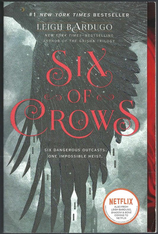 Front cover of Six of Crows by Leigh Bardugo with a crow in flight and red text.