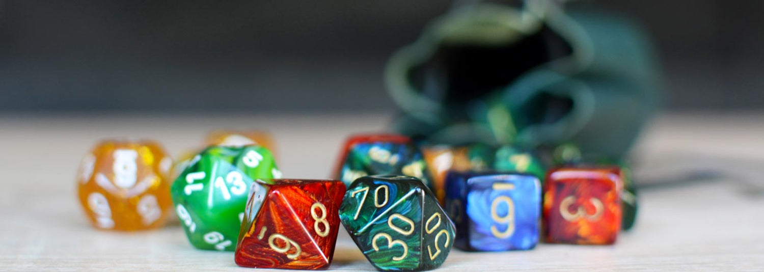 Polyhedral dice spilling out of a dice bag