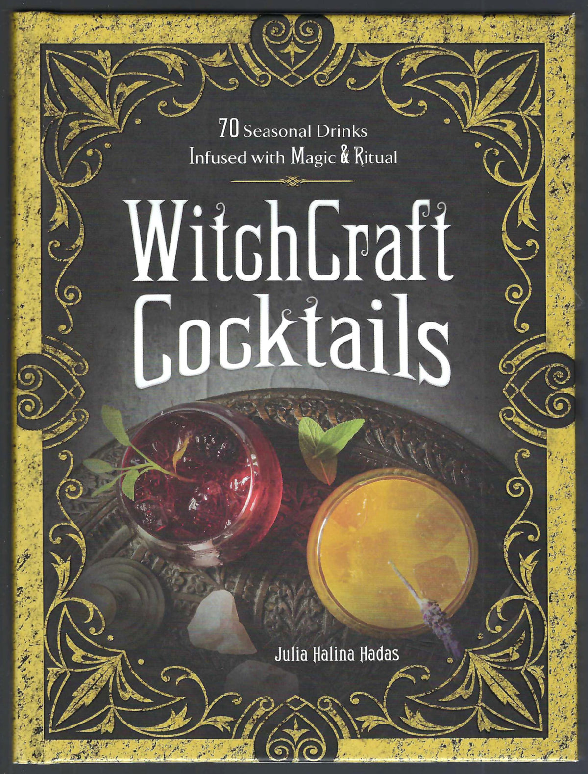 Front cover of WitchCraft Cocktails by Julia Halina Hadas, featuring an ornate gold and black border with two illustrated cocktails on a dark background.
